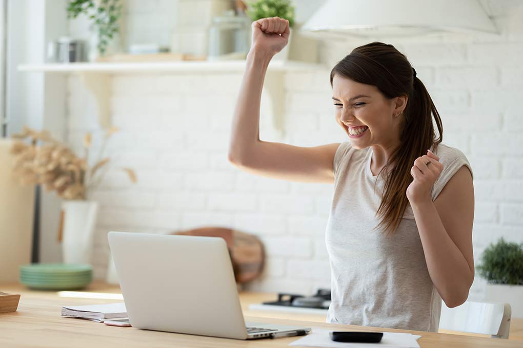 An entrepreneur celebrates after seeing how high her text marketing ROI is.